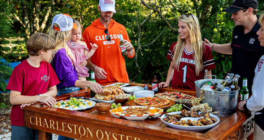 A family around an engraved Charleston Oyster Table